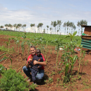 Dale with kid in garden