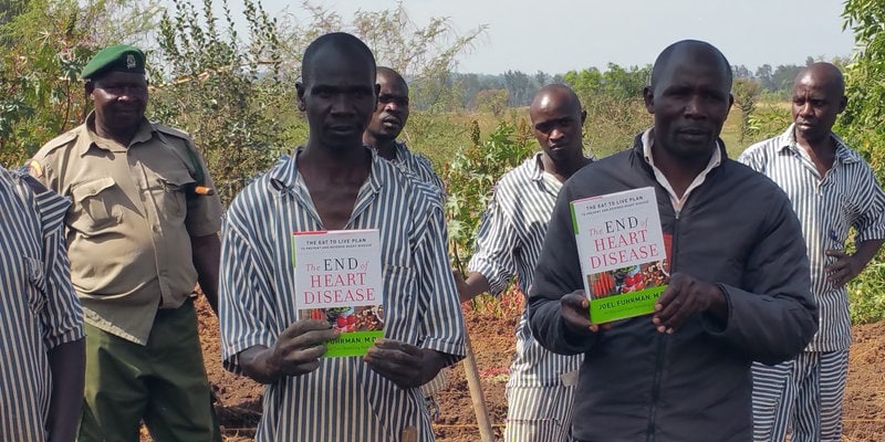 Prison Inmates Holding Books