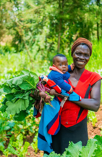 Woman with baby and beets